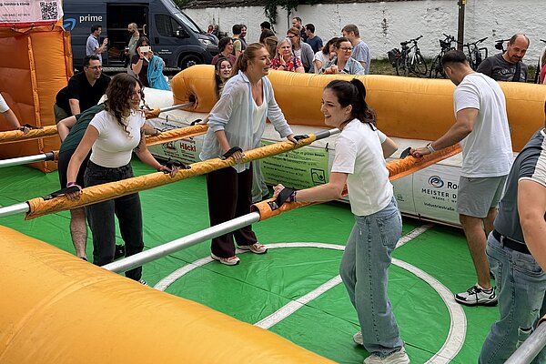 Teams in action during the live table football tournament.