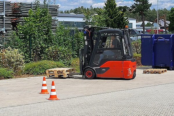 A forklift lifting a pallet.