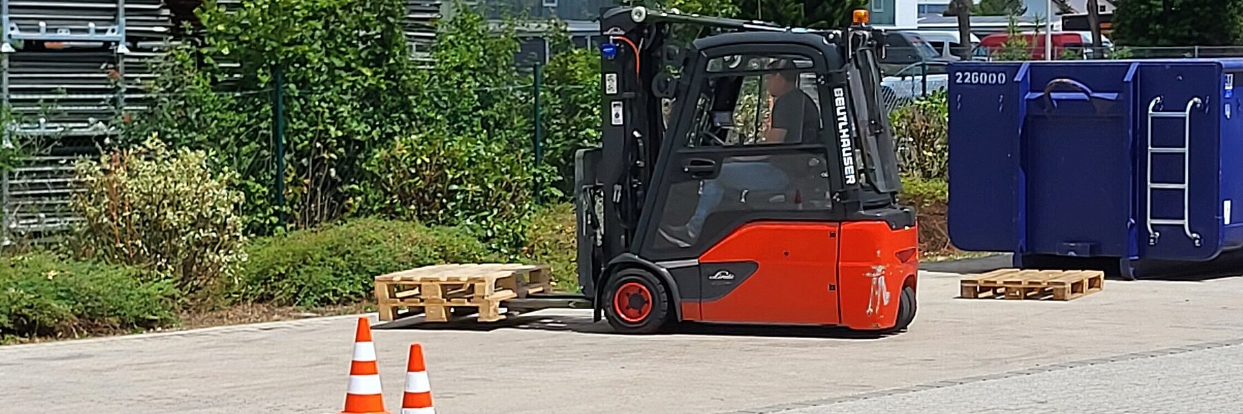 A forklift lifting a pallet.