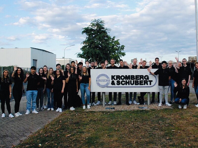 Group of all german trainees in front of the plant